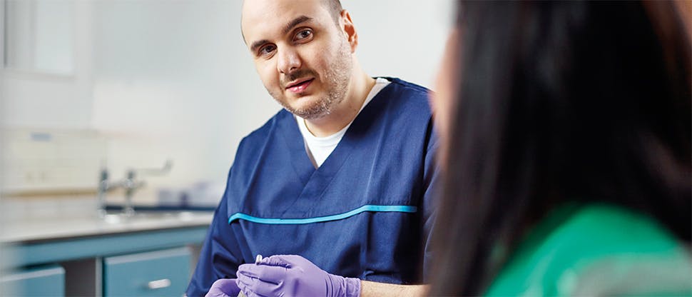 Patient with dentist for assessment 