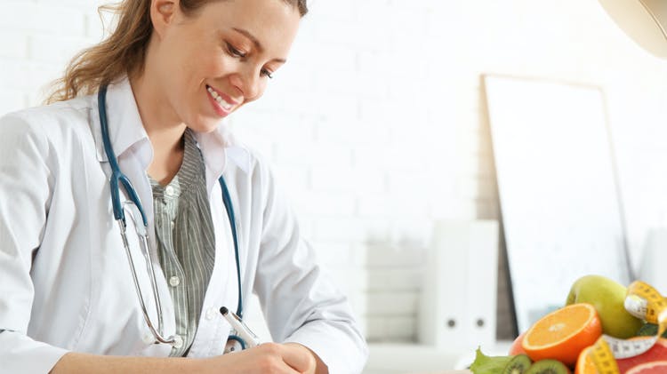 Doctor smiling while working