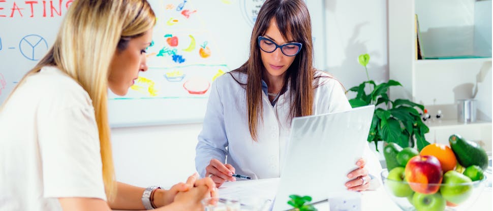 Nutritionist working with patient