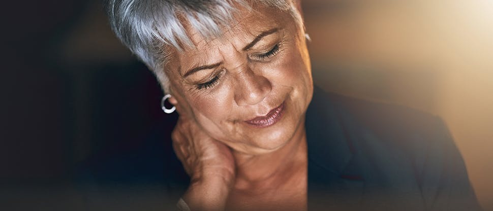 Woman holding neck