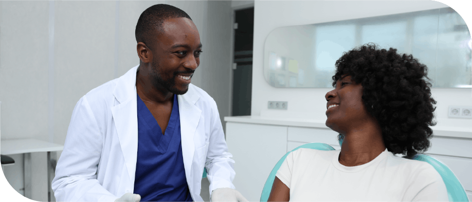 Male doctor talking to female patient