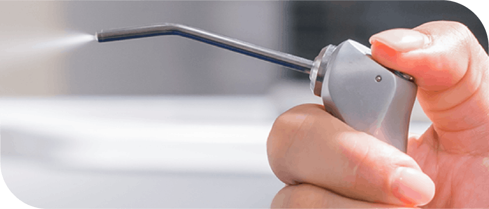 Arab dentist using the air probe