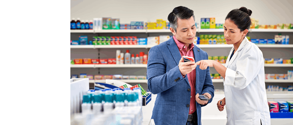 A pharmacist talking to a patient about a product. 