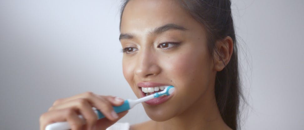 lady brushing teeth