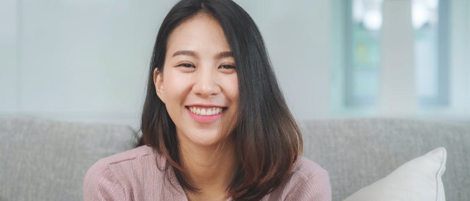 Woman facing camera and smiling