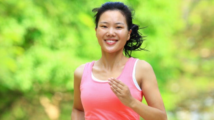 Lady smiling and running