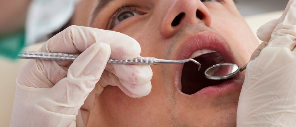 Patient having mouth examined