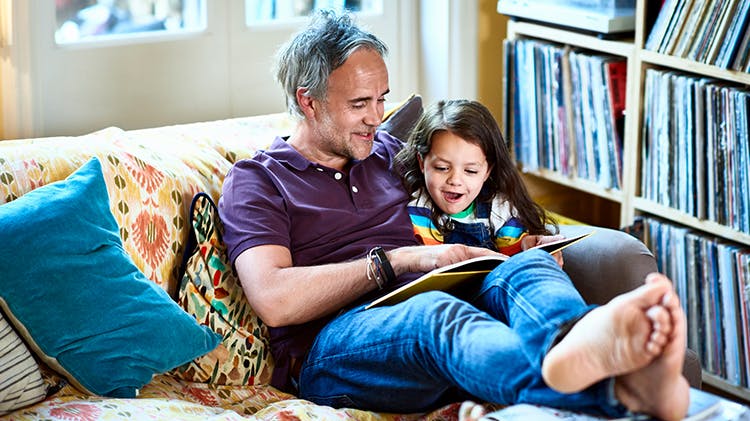 Man reading with child