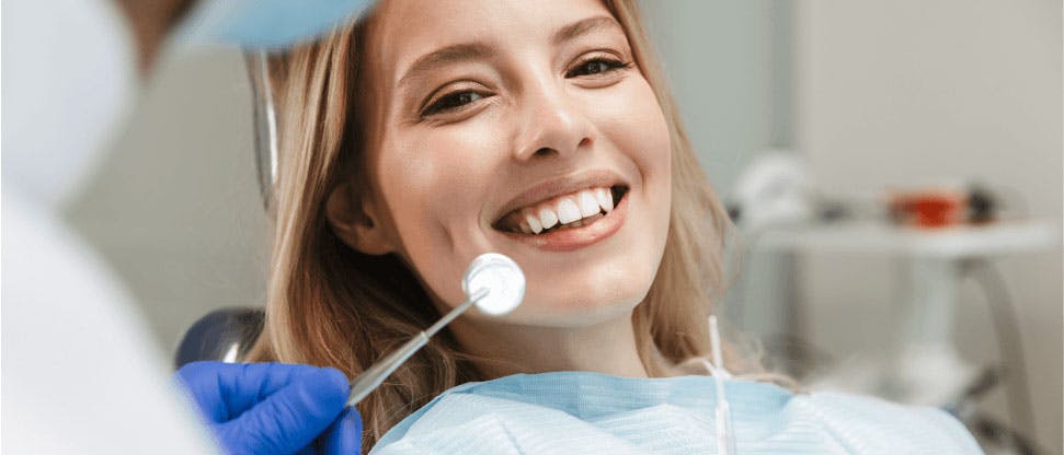 Dentist speaking with patient