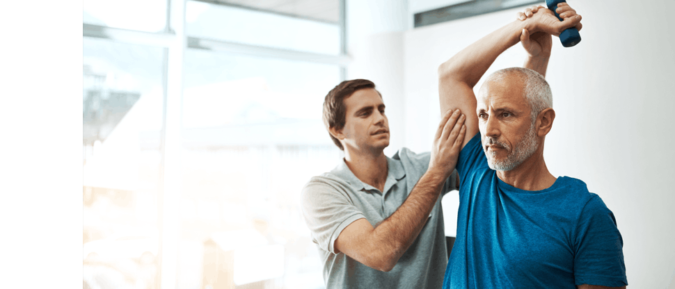 Physiotherapist doing a check-up of the elbow of an older man 