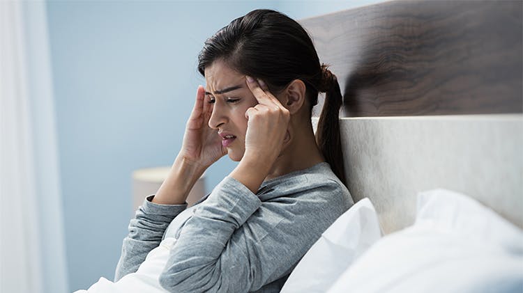 Woman with migraine