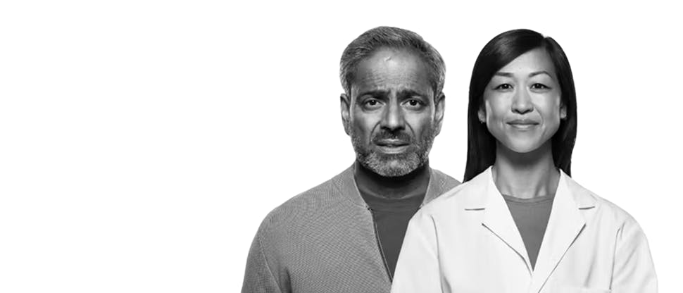 An anxious-looking male patient stands next to a confident, smiling female healthcare professional.