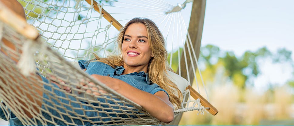 Woman smiling in hammock