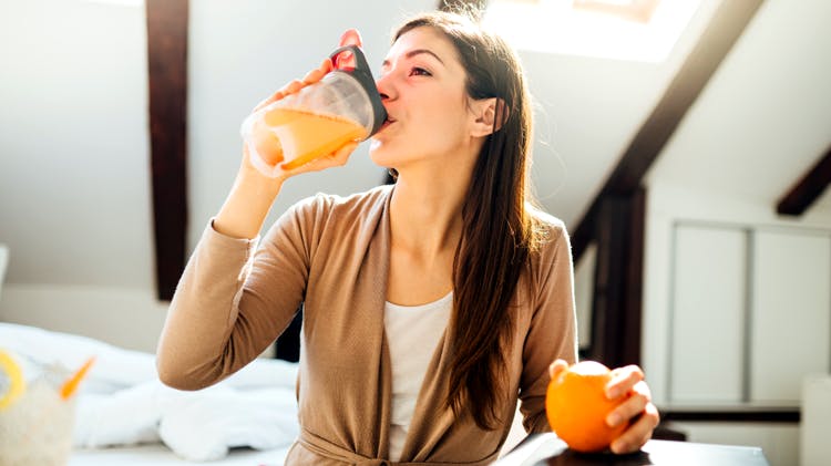 Woman drinking juice