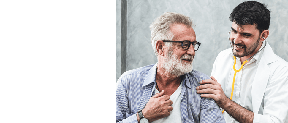A doctor wearing a stethoscope and doing checkup of an older man