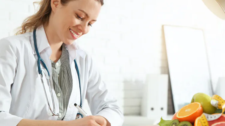 Doctor smiling while working