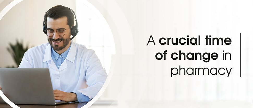 EXPERT_Mental Resilience_GHP Article_Header_A crucial time of change A pharmacist works happily at a computer.