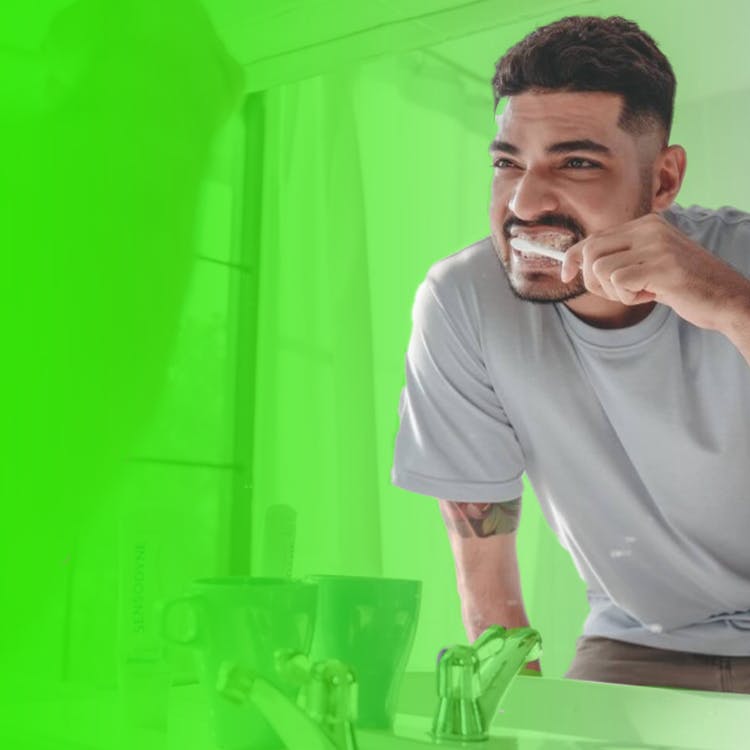 Image of a patient brushing teeth at home