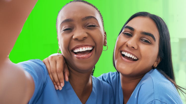 Image of two hygienists smiling