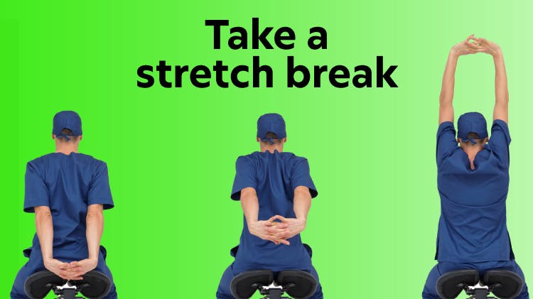 Image of a person stretching their arms and shoulders in an office setting