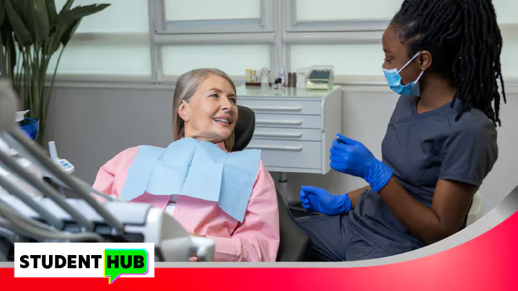 Dentist talking to female patient