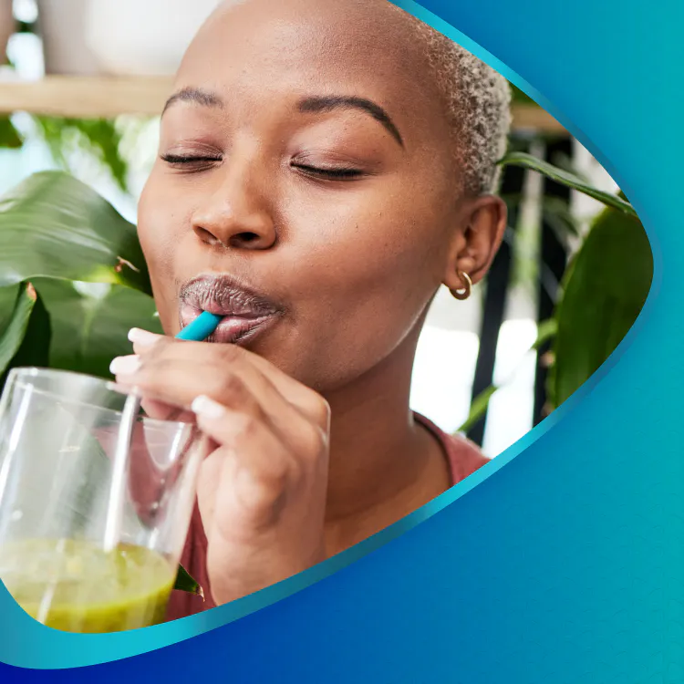 Woman drinking smoothie through straw with header Enamel Wear