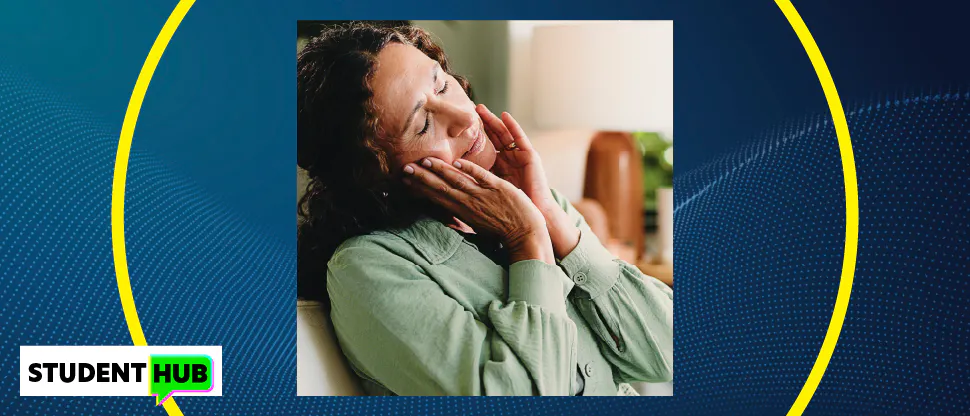 Image of a woman in pain, holding the side of her face