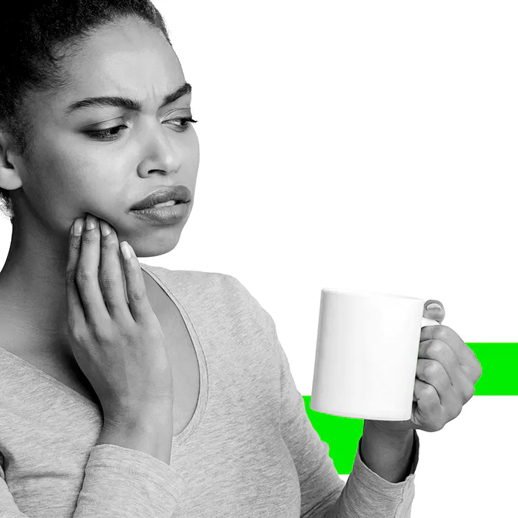 Woman holding mouth in pain with the oral health conditions