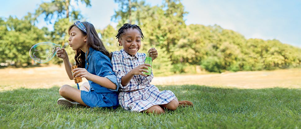 Children blowing bubbles