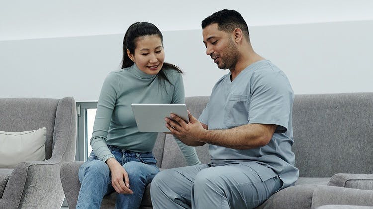 A healthcare professional talking to his patient