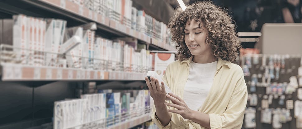 Young woman shopping for toothpaste