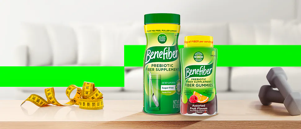 Two different Benefiber product containers on a table with measuring tape and exercise weights.