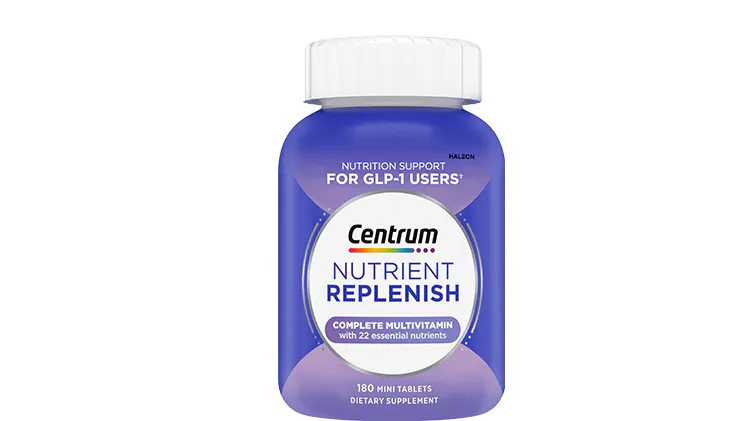 Container of Centrum multivitamin tablets with a purple label.