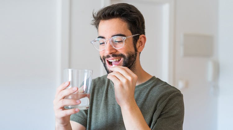 Man taking pill