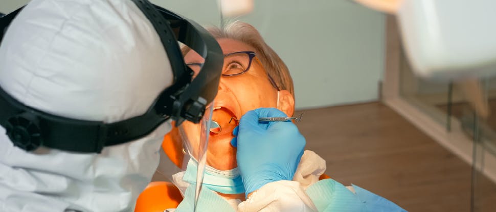 Dentist explaining gum disease to dental patient