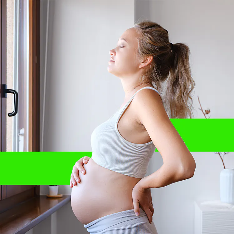 Pregnant mom looking out of a window