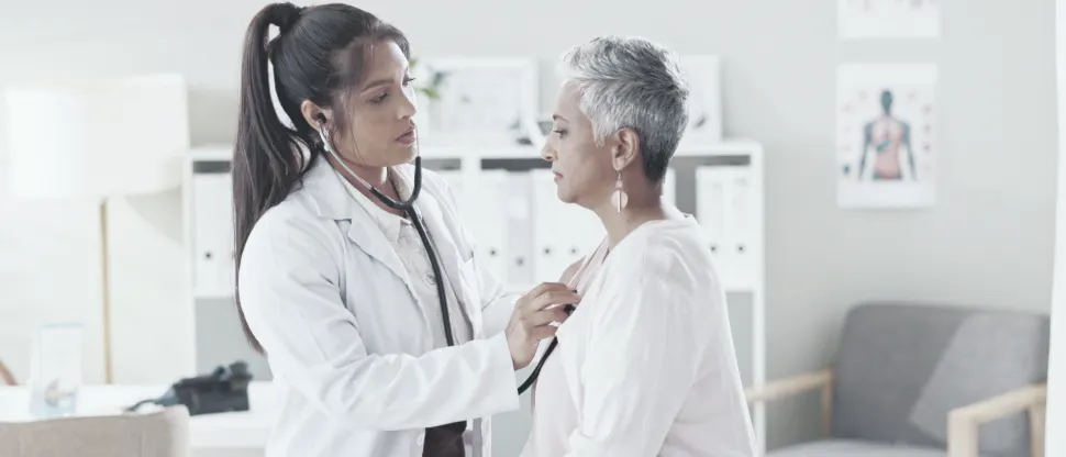 Doctor checking patient’s heart