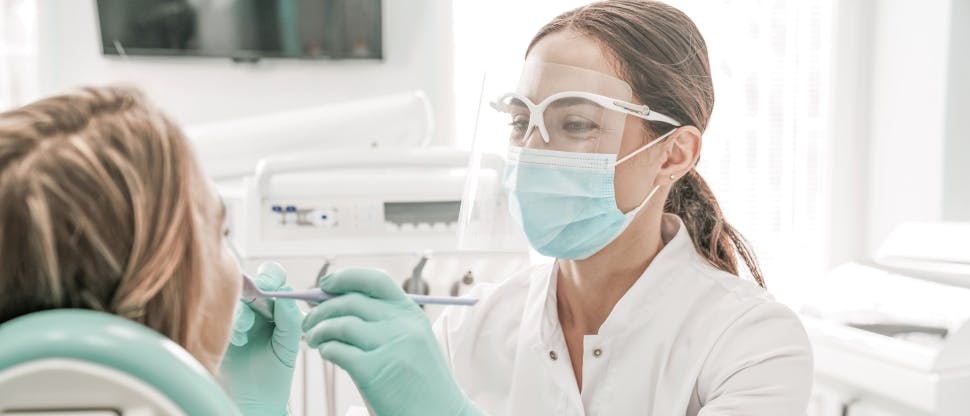 Dentist and patient during dental visit