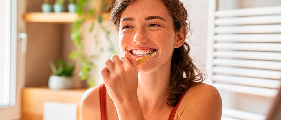 Woman brushing teeth