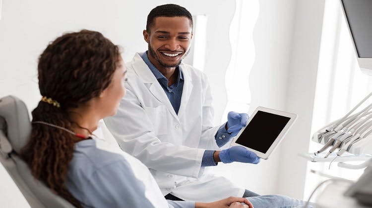 Dentist and Patient reviewing a tablet