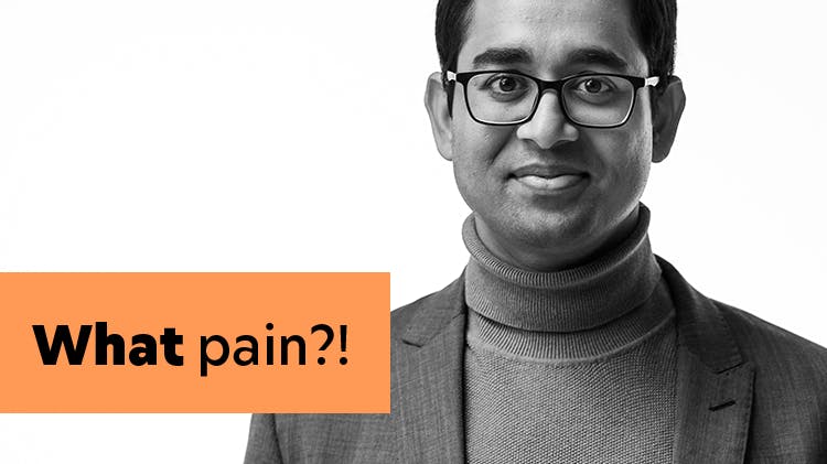 Image of a smiling man wearing glasses. Text: What pain?!