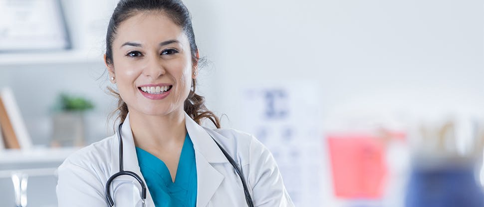 female clinician smiling