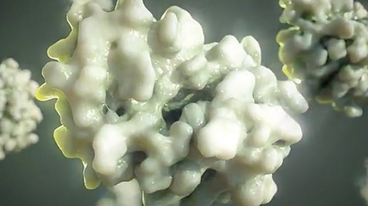 Image agrandie des particules de mucus causées par les rhumes et la grippe.