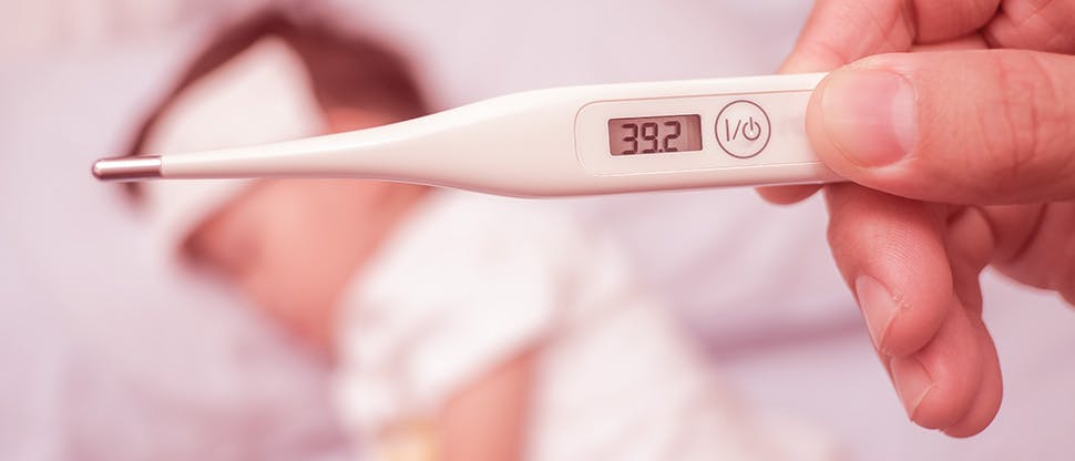 fever-close-up-medical-thermometer-parent-measuring-temperature-of-his-ill-kid