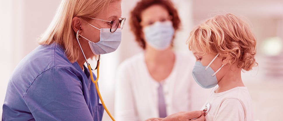 pediatrician-doctor-examining-sick-child
