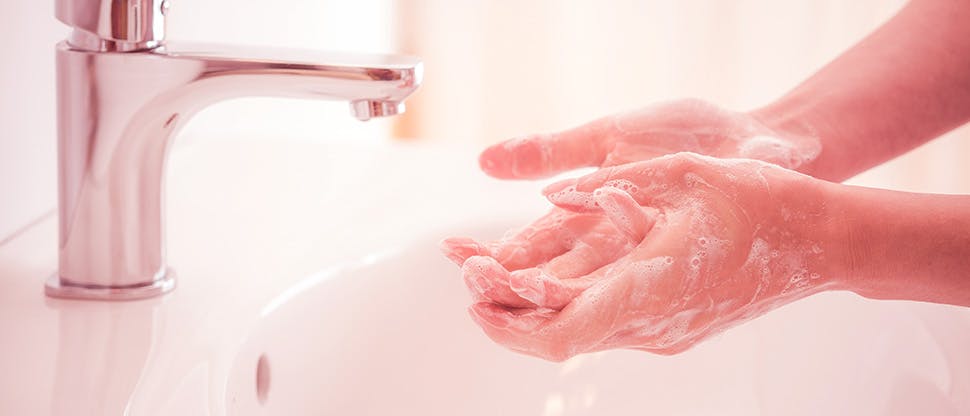 washing-hands-with-soap-under-the-faucet-with-water
