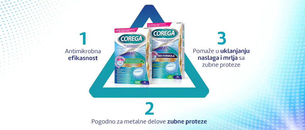 Stomatolog razgovara sa pacijentom o protezama, pacijent se osmehuje