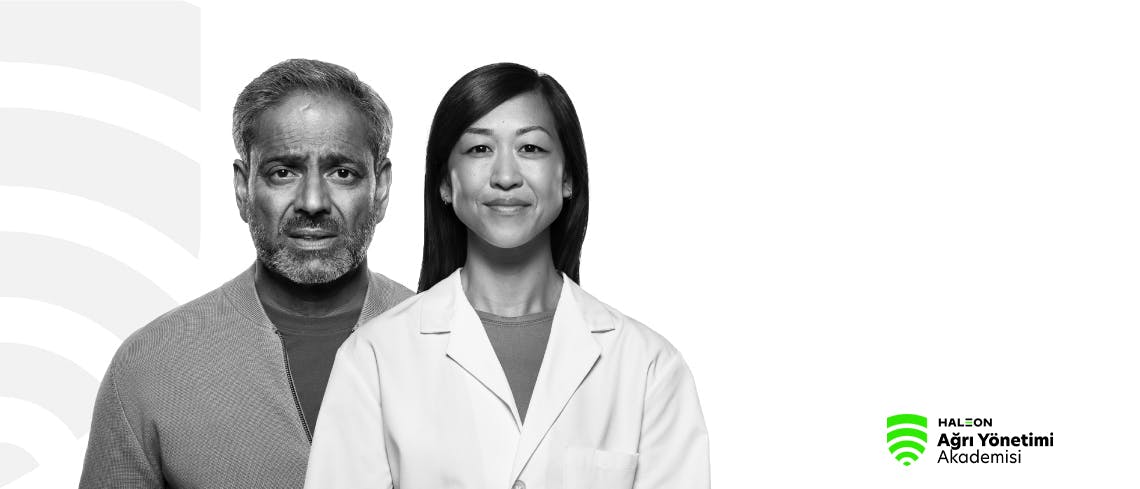 Ağrı içinde kaşlarını çatmış orta yaşlı bir adam ile yanında duran genç kadın doktorun görüntüsü