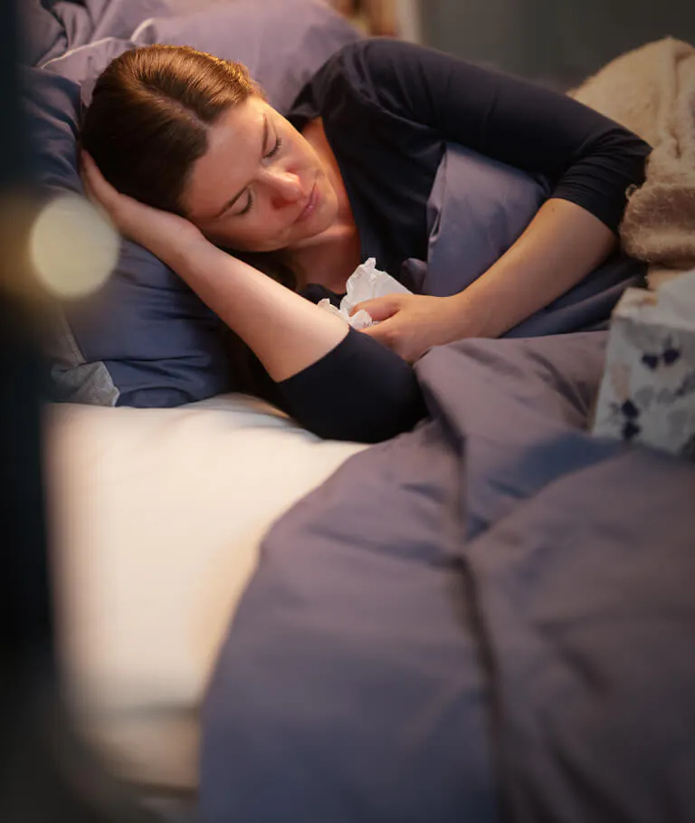 Woman with cold resting