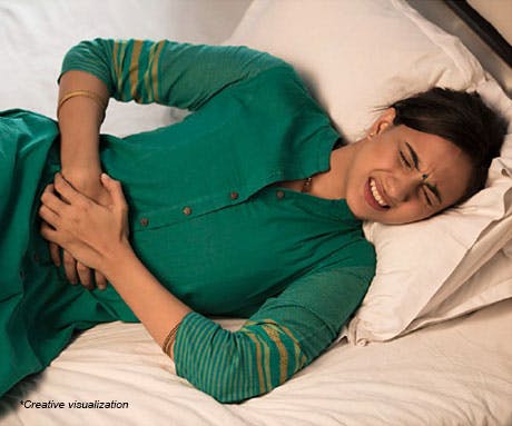 Woman holding her stomach in pain 